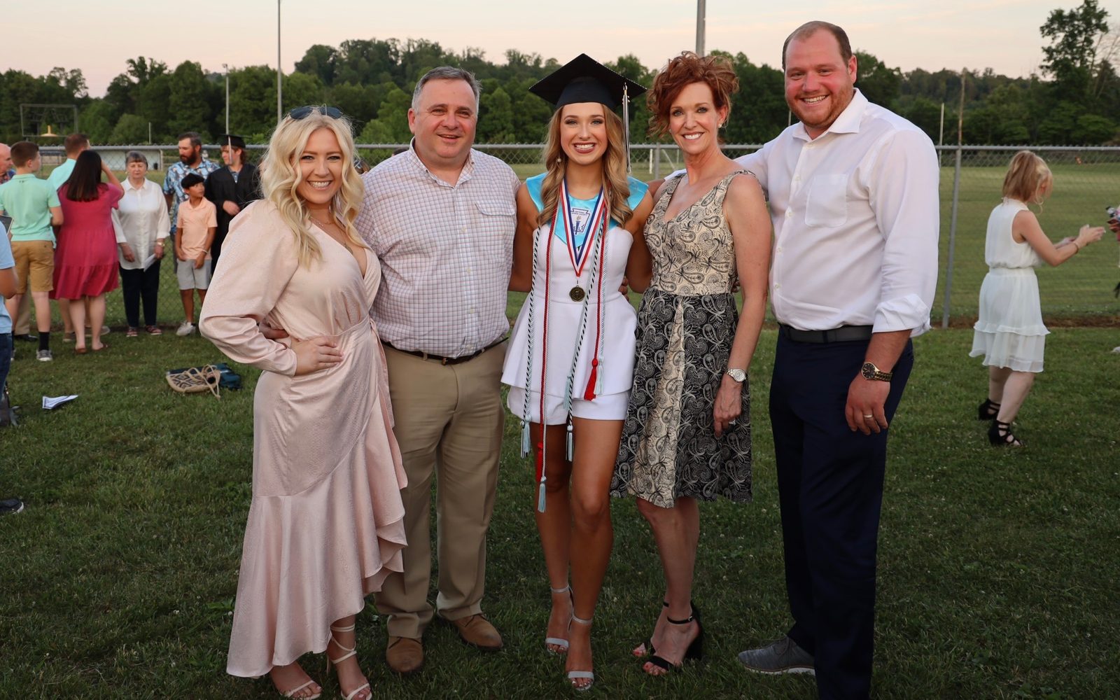The Shuford family together at Whittlee's high school graduation: Tori, Whitt, Whittlee, Dorothy, and Jackson