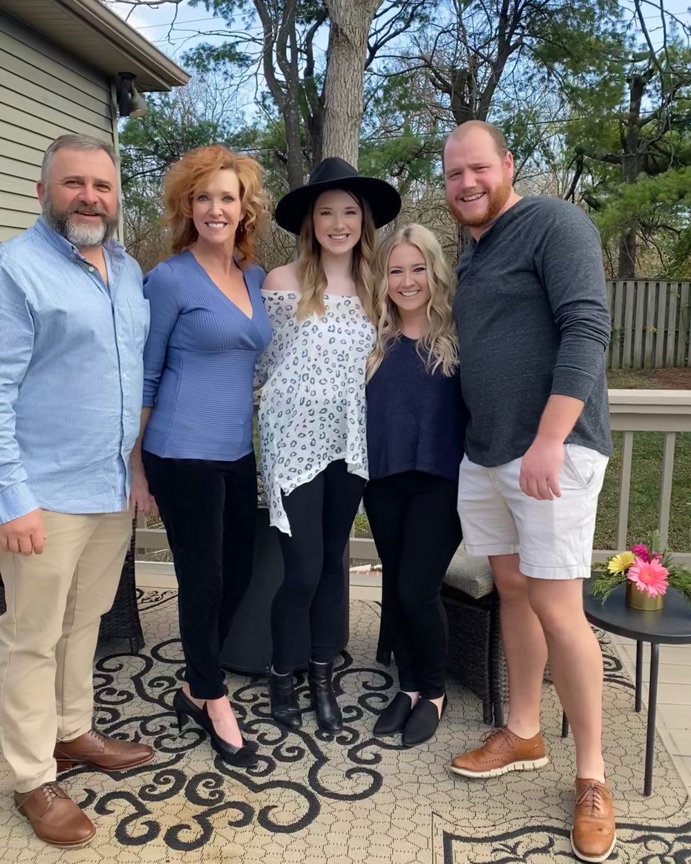 Whitt, Dorothy, Whittlee, Tori, and Jackson together on a back patio