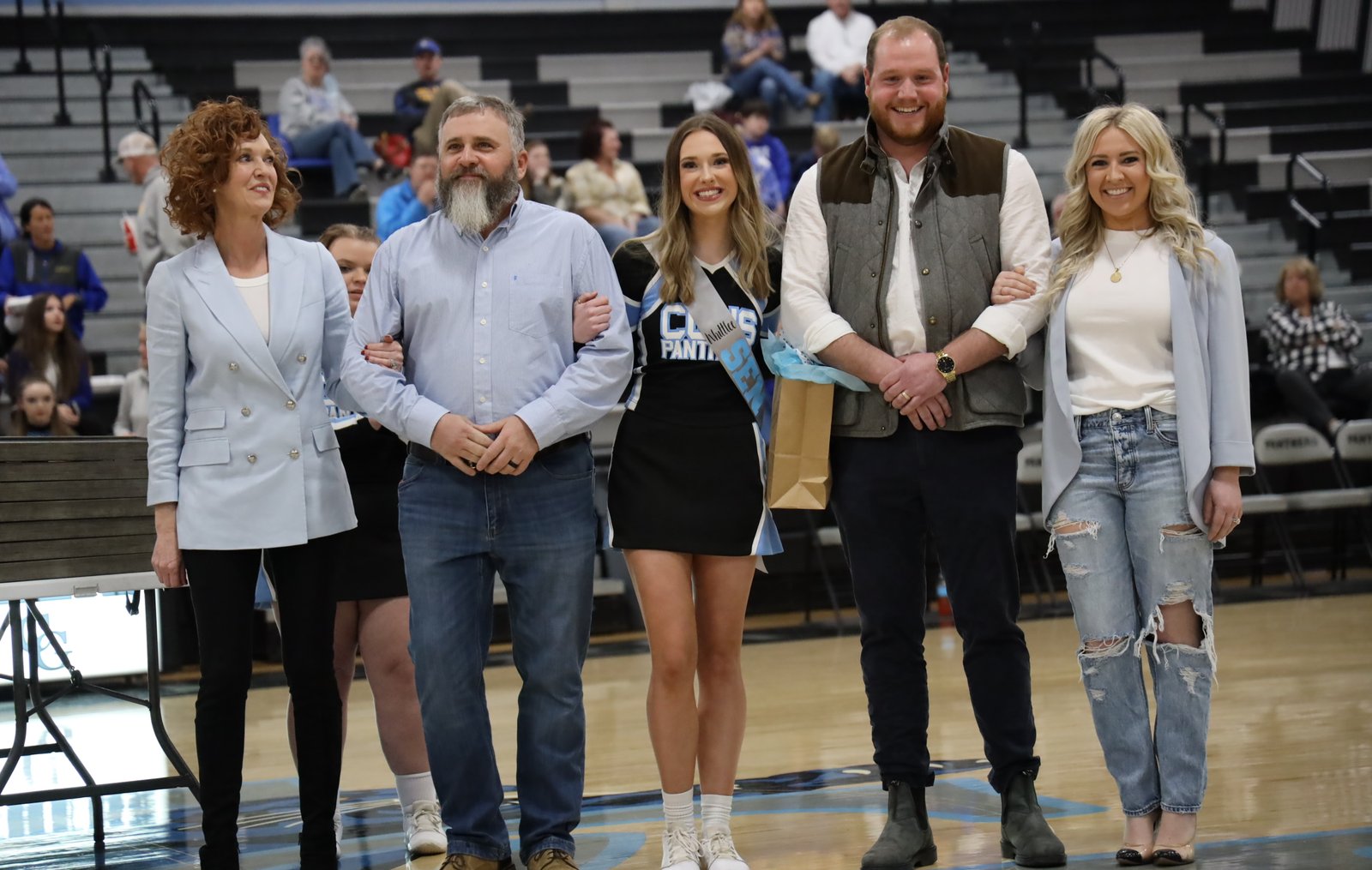 The Shuford family together at Whittlee's Cumberland Gap High School senior night: Dorothy, Whitt, Whittlee in her Panthers cheer uniform, Jackson, and Tori