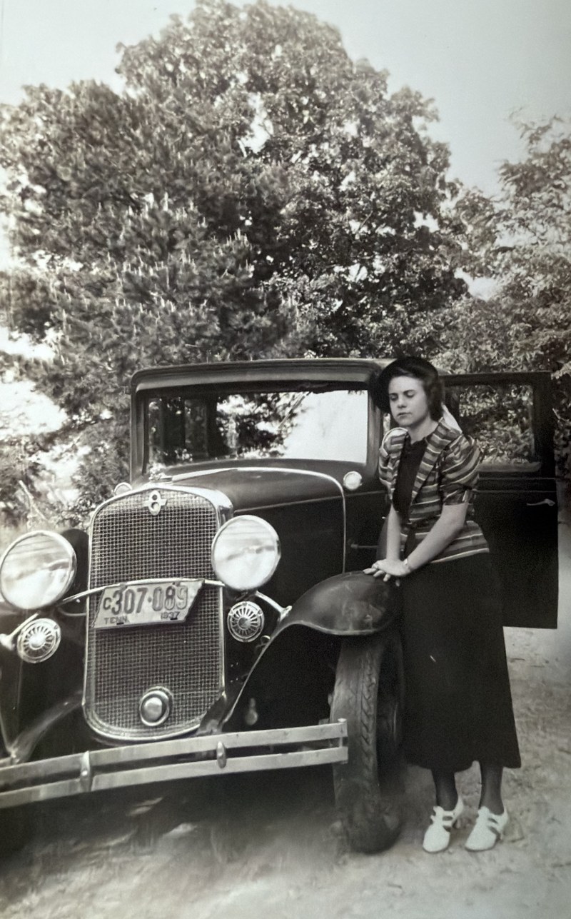 Ruth Fugate, known as Nanny, standing by the family car in 1937